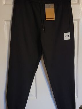 The North Face Black Sweatpants with Logo Patch